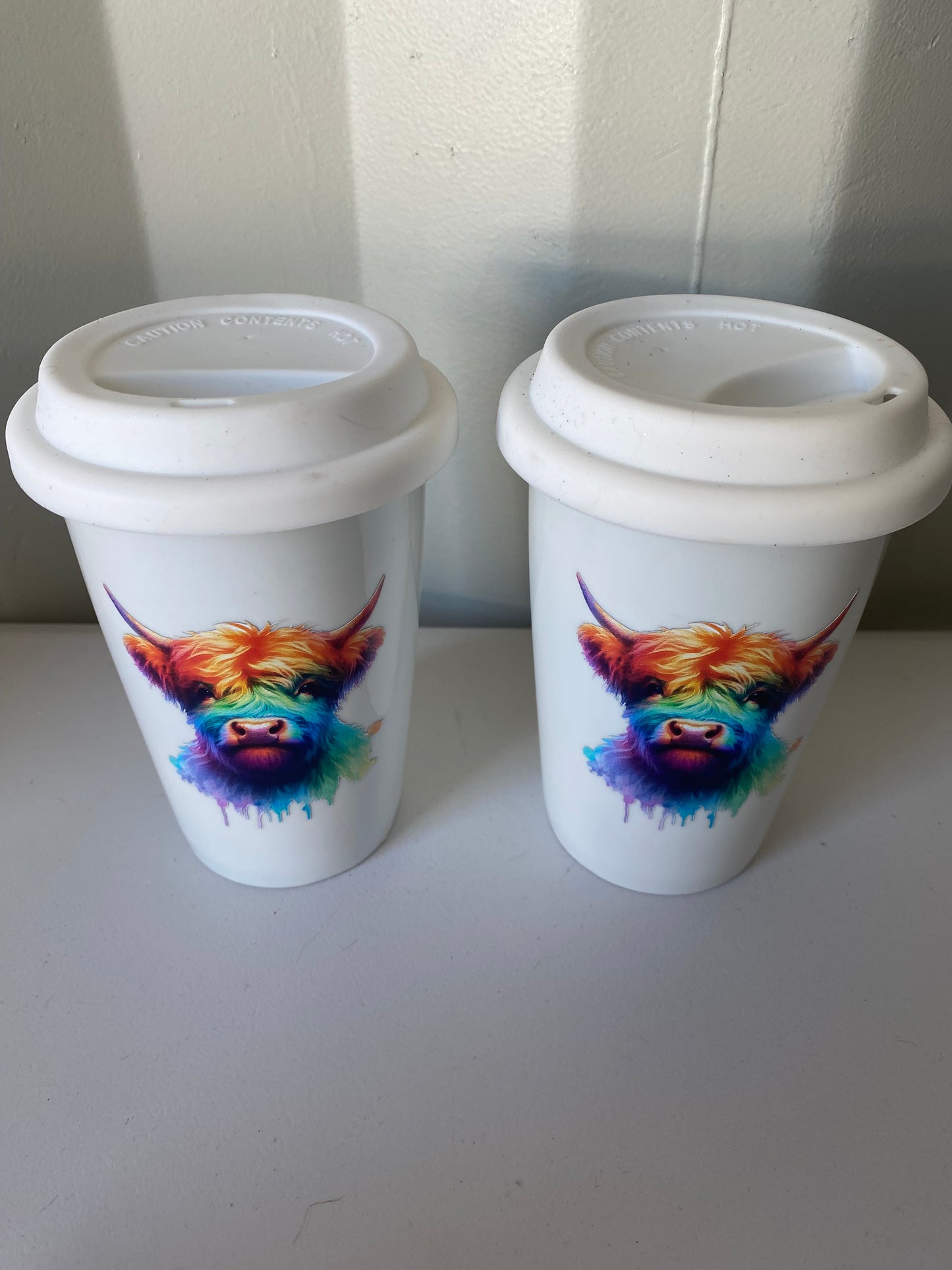 Ceramic rainbow highland cow travel mug