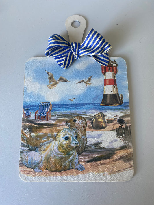 Seal and lighthouse decorative cheeseboard hanger
